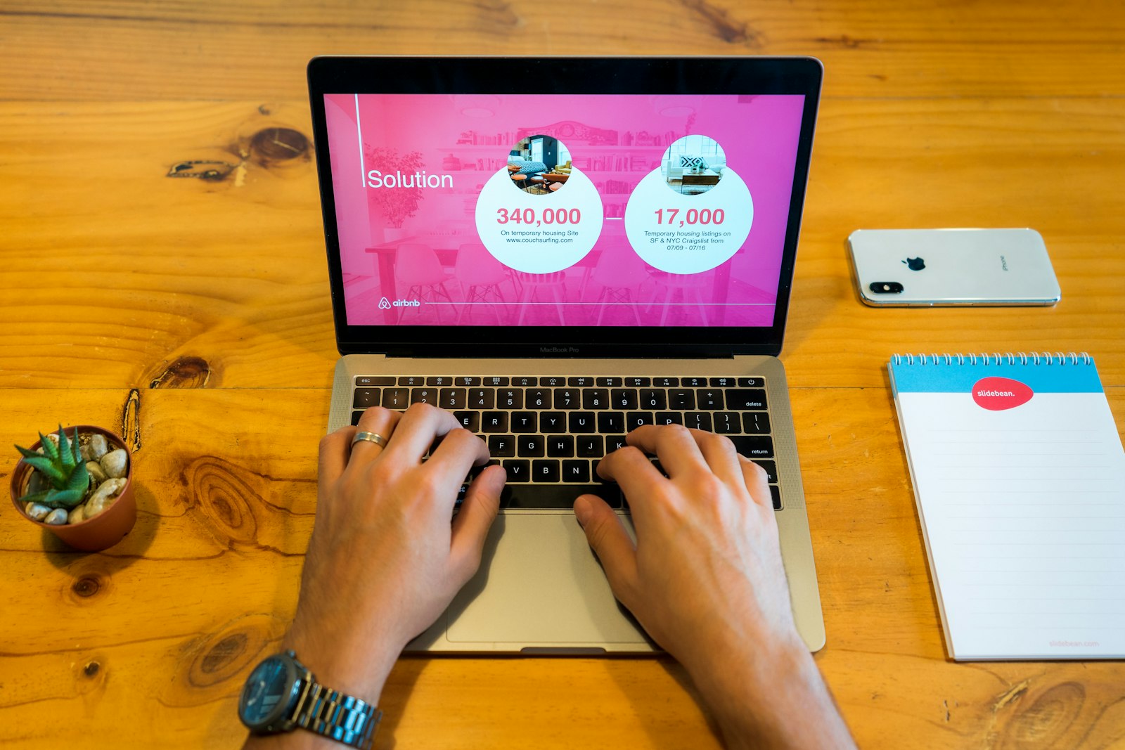 AI-generated pitch deck slides on a laptop screen