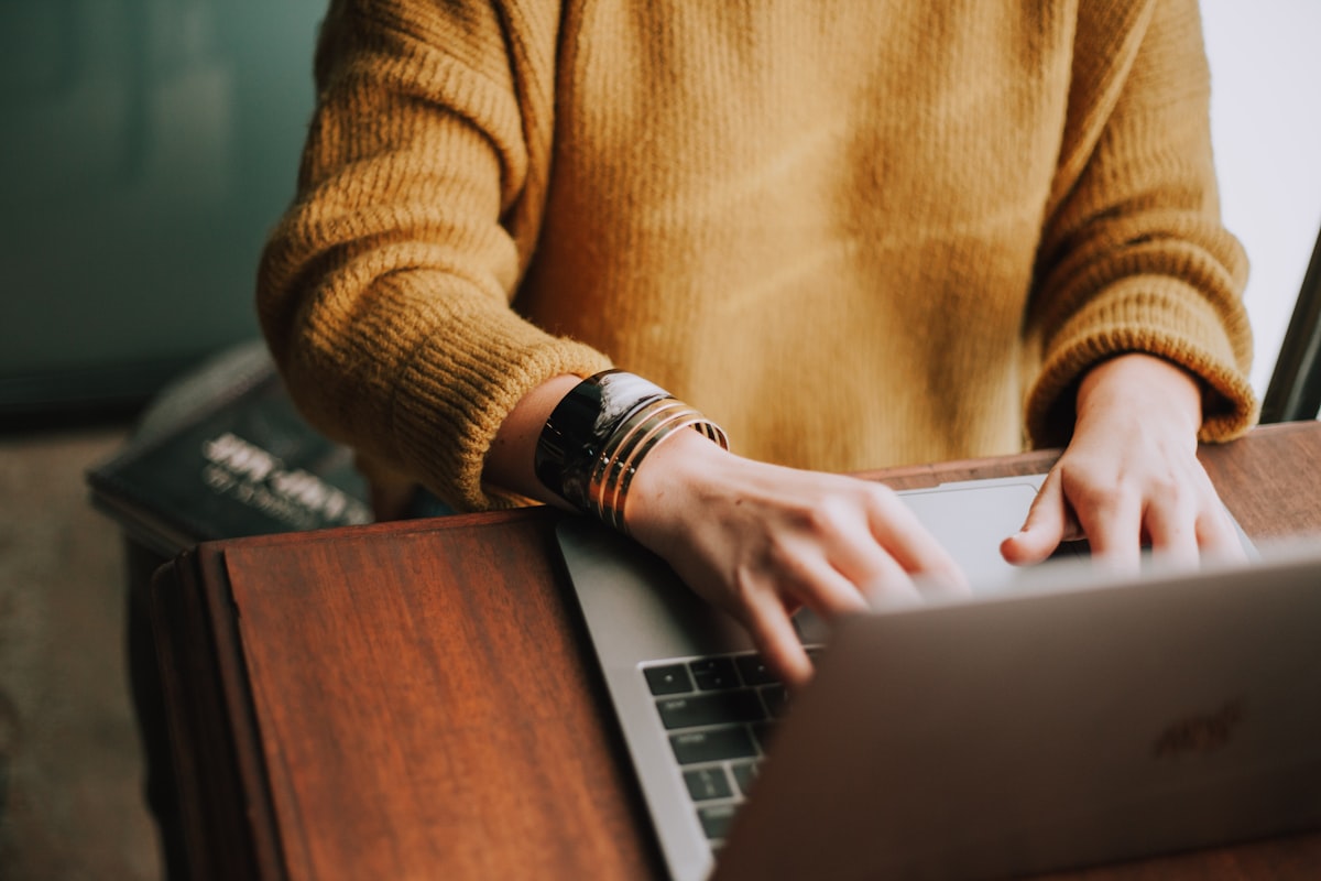 Student writing notes from AI-summarized study materials