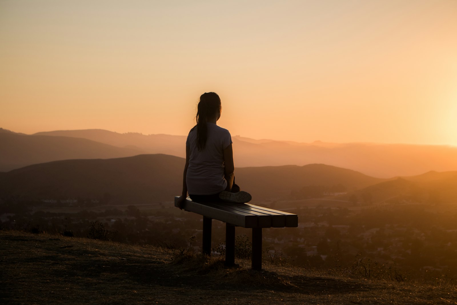 Person doing yoga and meditation with a wearable health tracker