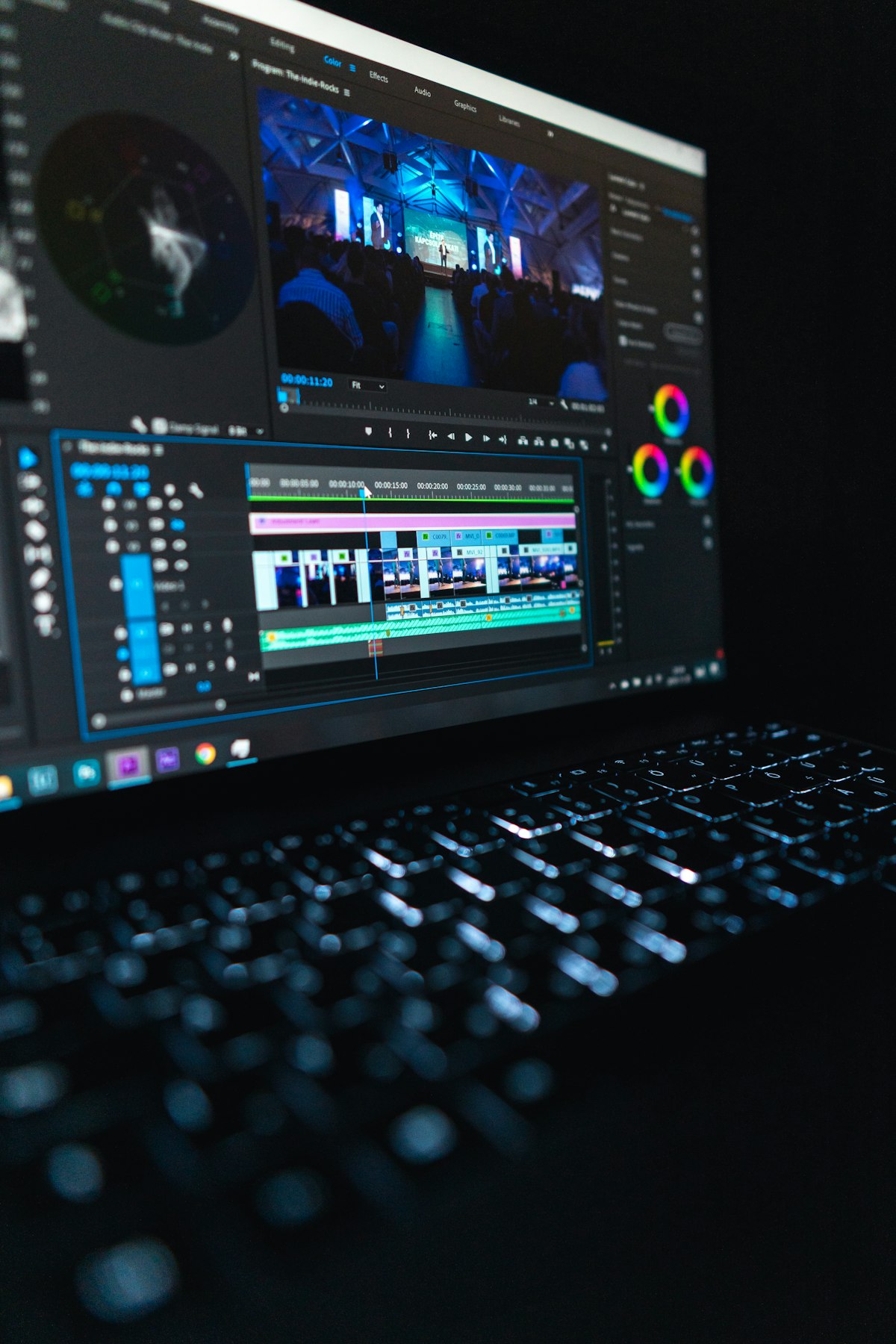 Photographer editing photos on a calibrated monitor in a studio