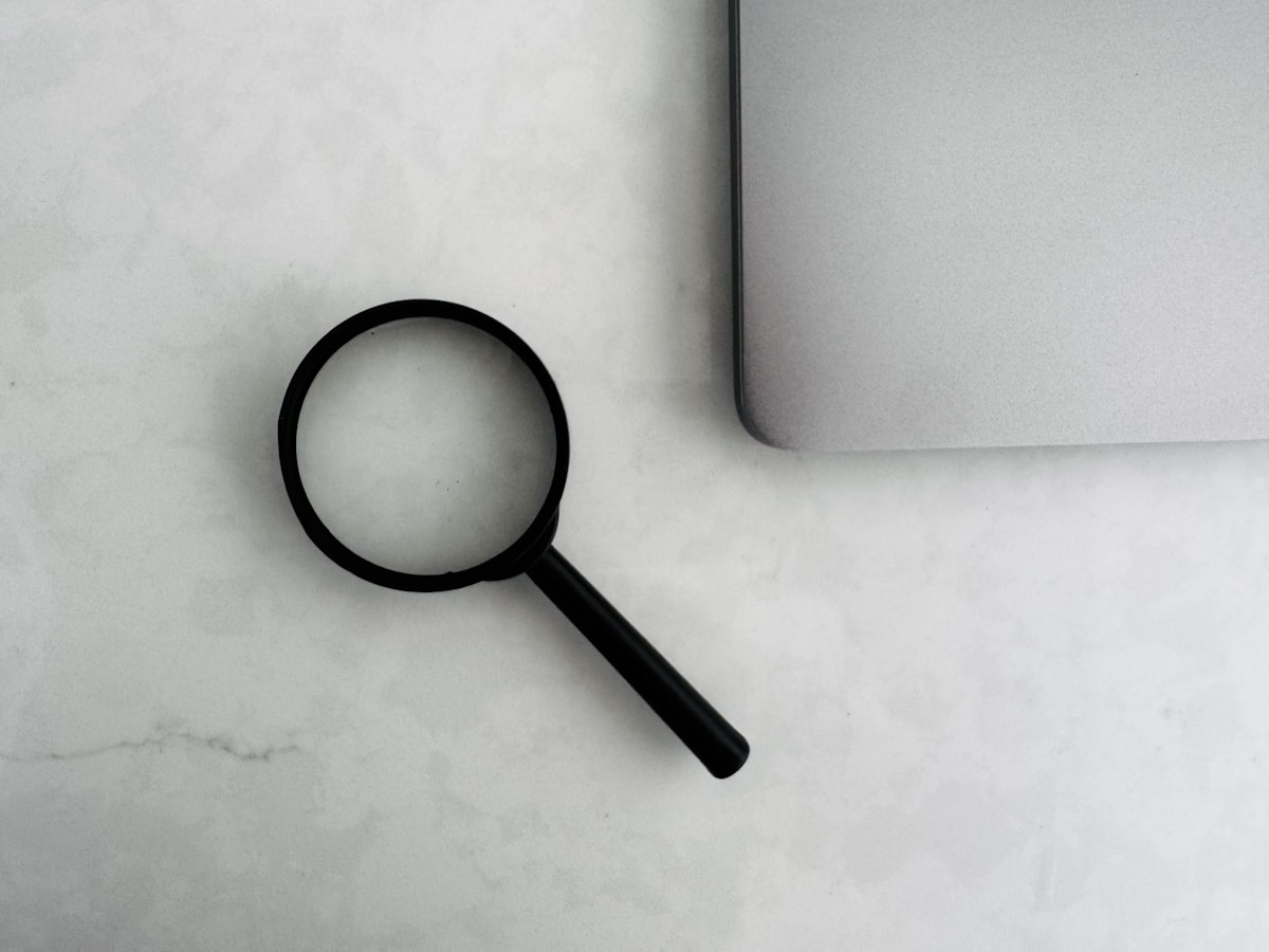 Researcher comparing search results on a laptop