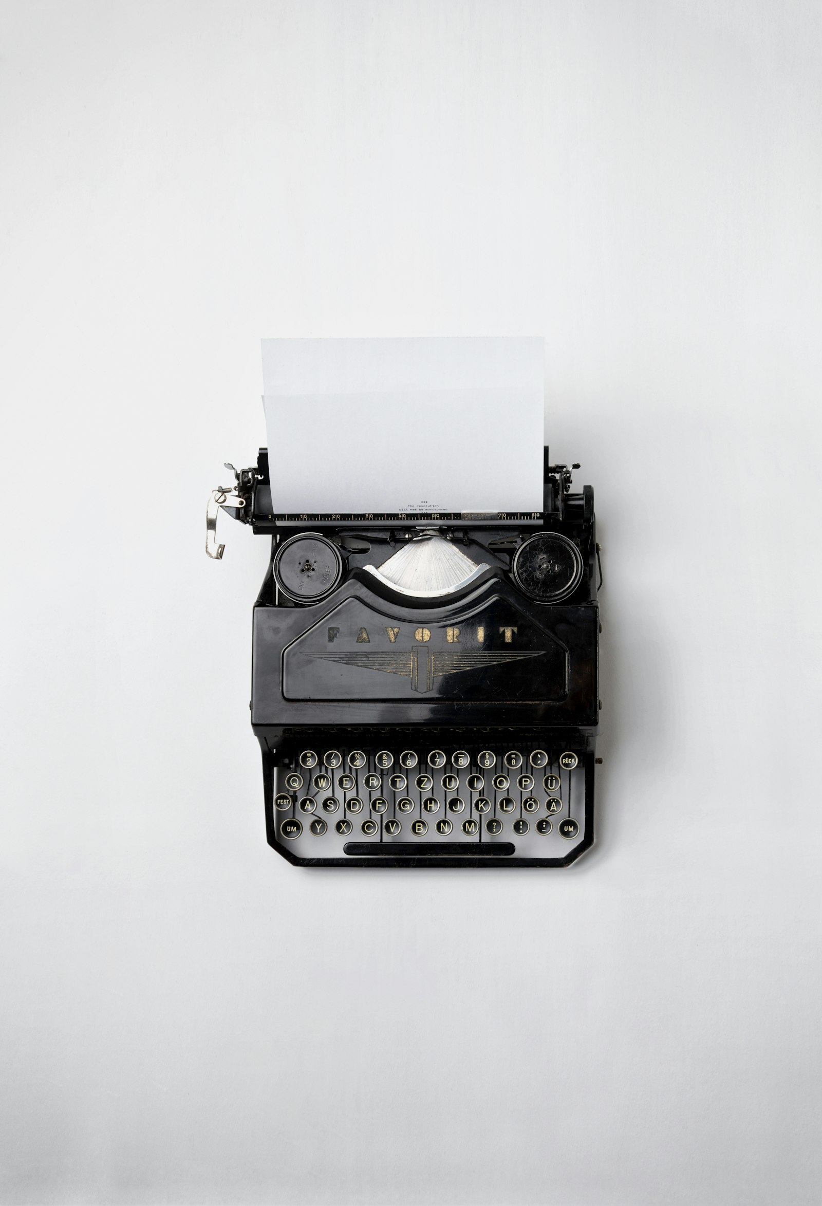 Vintage typewriter with a fresh page