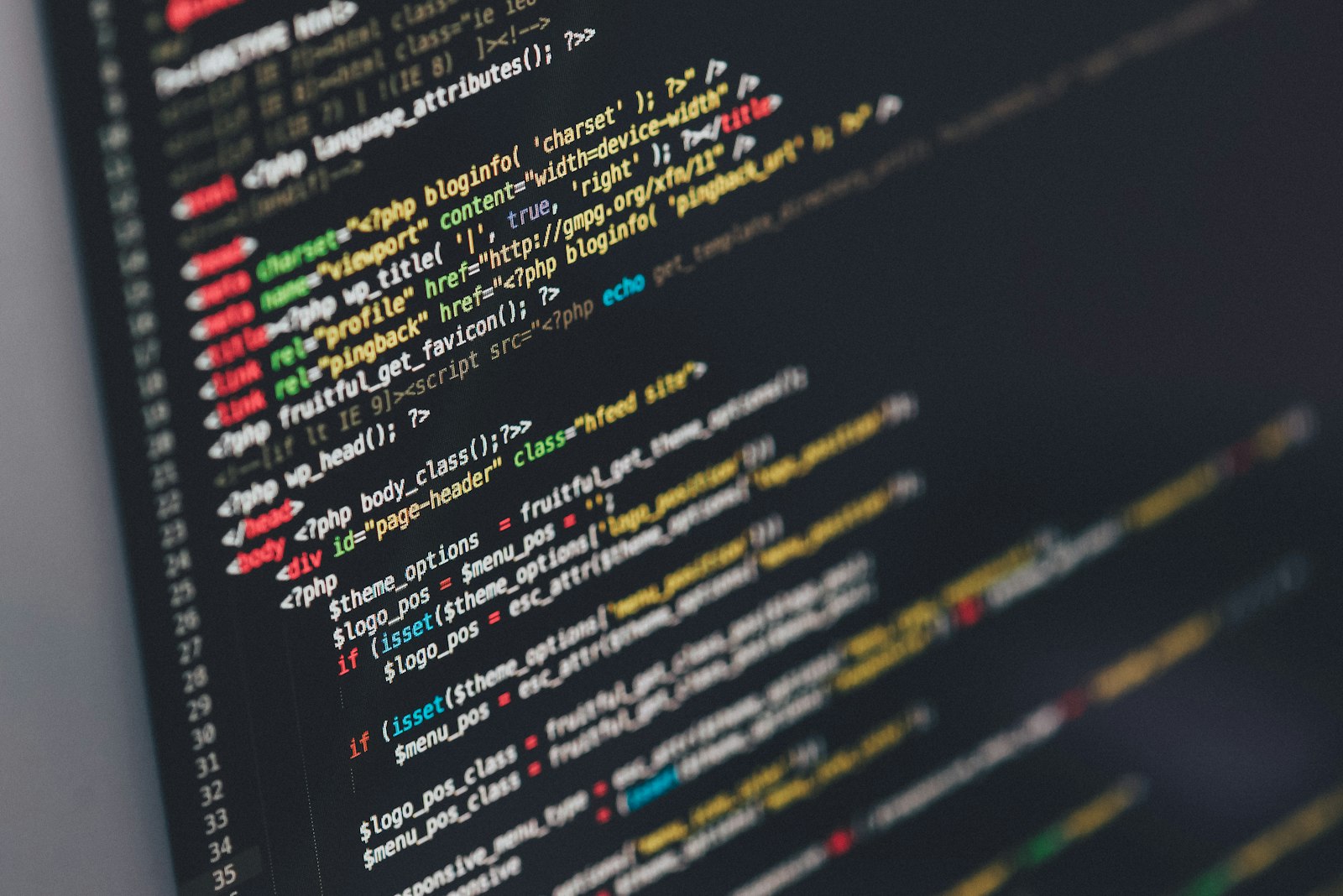 Terminal and editor split-view with code lit on a dark workstation