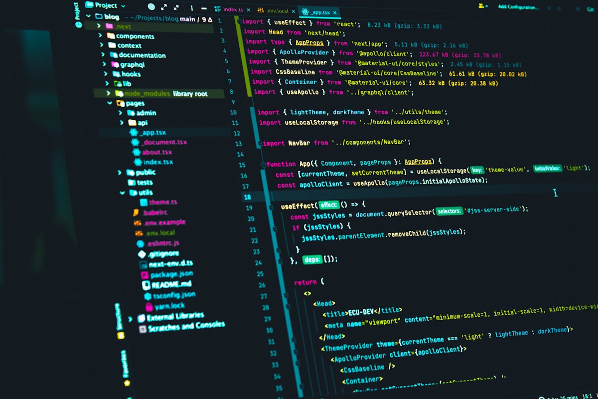 Developer workspace lit at night with multiple screens